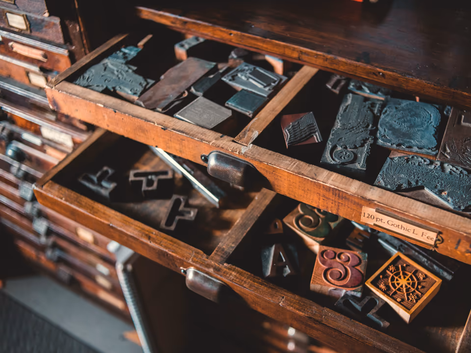 A wooden case of vintage letterpress type blocks
